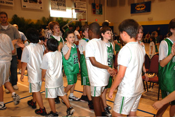  Members of the St. Peters United Methodist Upward Basketball League signal the game ending with high fives for the last time of the season. 