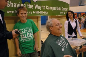 Wellington Landings Assistant principal Jim Riley gets a little squirmy as one of the students prepares to shave him bald. The event was held at several area schools as part of the St. Baldrick's Foundation Shave for the Cure event held every March to raise money for cancer awareness.