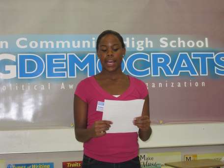 Victoria Davy, Vice-President of Programming, reads Representative Abruzzo's bio and introduces him to the club.